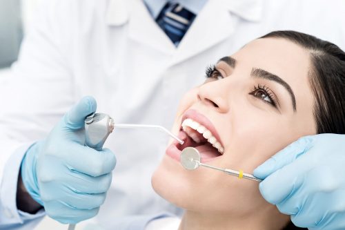 Woman Receiving a Teeth Cleaning