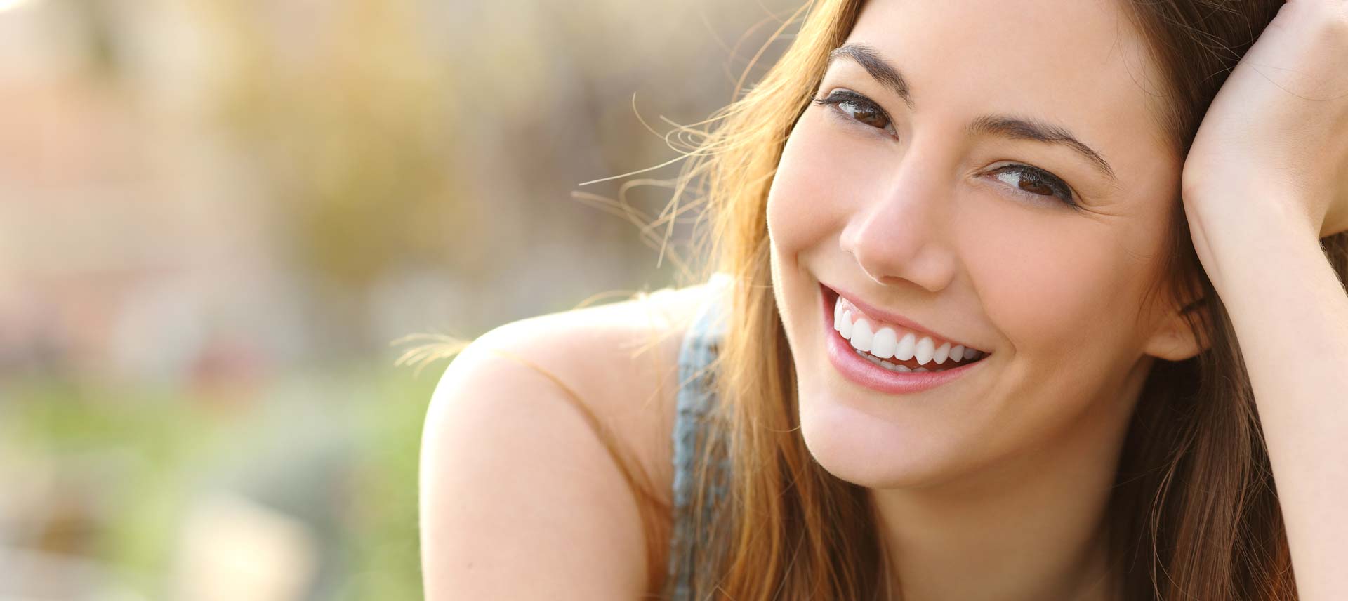 Woman Smiling While Sitting Outside