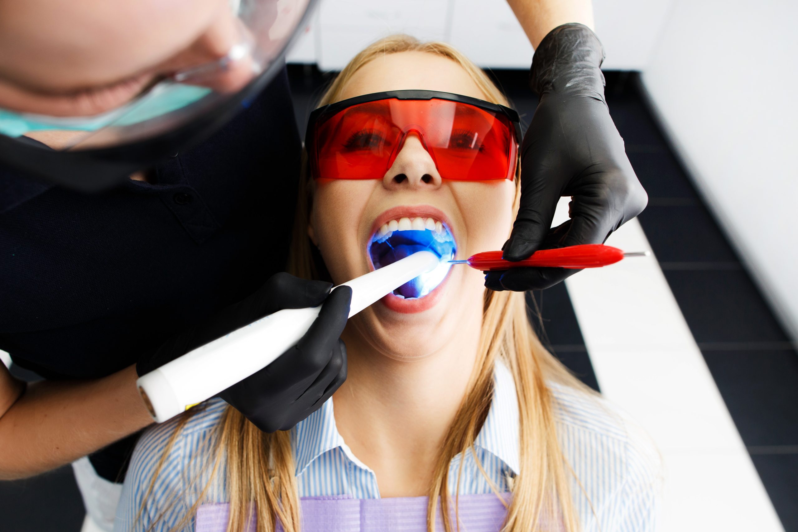 Woman Undergoing Teeth Whitening Procedure